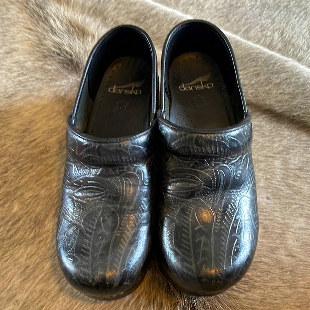 Dansko tooled leather clogs